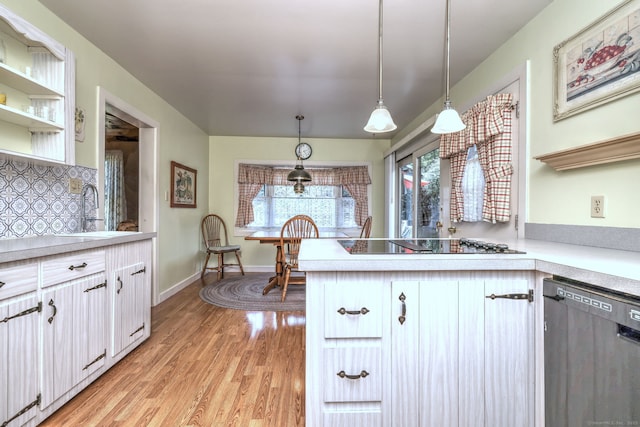21 Oakwood Ave, Waterbury, CT 06708 - kitchen featuring dishwasher, black electric stovetop, light wood-style flooring, backsplash, and light countertops
