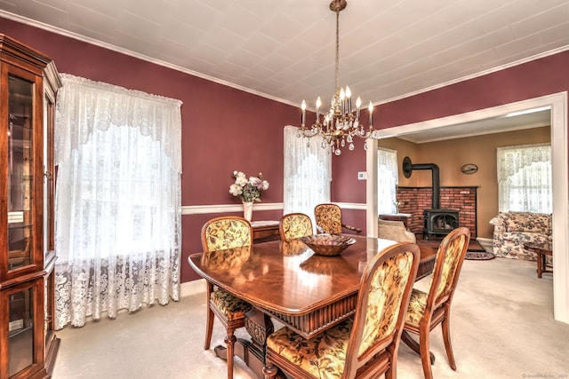 21 Oakwood Ave, Waterbury, CT 06708 - carpeted dining space featuring a wood stove, crown molding, and a chandelier