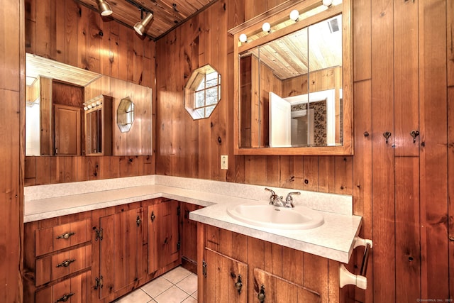 21 Oakwood Ave, Waterbury, CT 06708 - bathroom with vanity, wooden walls, wood ceiling, tile patterned flooring, and track lighting