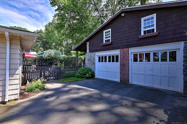 21 Oakwood Ave, Waterbury, CT 06708 - view of side of property featuring asphalt driveway