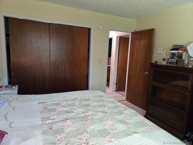 177 Lisle St Apt 5, Torrington, CT 06790 - bedroom featuring a closet and a textured ceiling