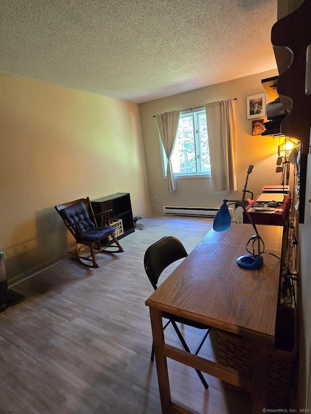 177 Lisle St Apt 5, Torrington, CT 06790 - home office with wood finished floors, a textured ceiling, and a baseboard radiator