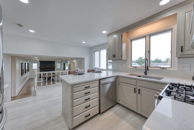 32 Patriot Ln, Newington, CT 06111 - kitchen with dishwasher, a peninsula, recessed lighting, open floor plan, and light stone countertops