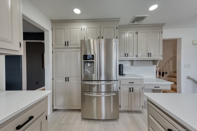 32 Patriot Ln, Newington, CT 06111 - kitchen featuring stainless steel fridge, recessed lighting, backsplash, and light stone counters