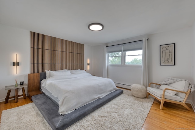32 Patriot Ln, Newington, CT 06111 - bedroom with light wood-style floors and baseboard heating