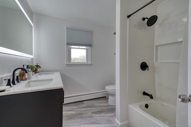 32 Patriot Ln, Newington, CT 06111 - full bathroom featuring baseboard heating, double vanity, and bathtub / shower combination