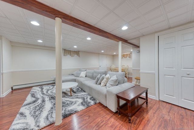 32 Patriot Ln, Newington, CT 06111 - living area featuring a baseboard heating unit, recessed lighting, and wood finished floors