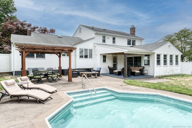 32 Patriot Ln, Newington, CT 06111 - back of property with an outdoor hangout area, a chimney, a patio area, and a shingled roof