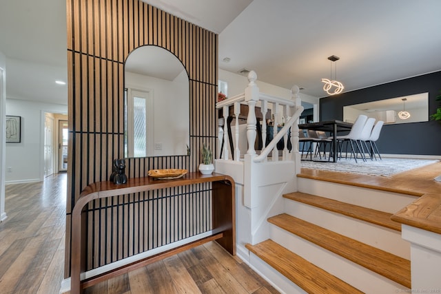 32 Patriot Ln, Newington, CT 06111 - stairway with wood finished floors and arched walkways