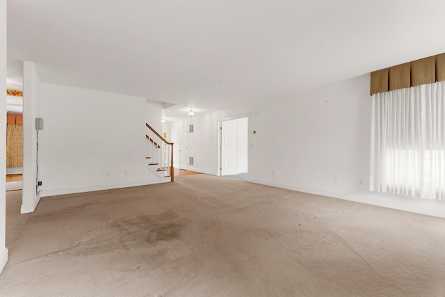 15 Sweet Meadow Dr, South Windsor, CT 06074 - unfurnished living room featuring stairs and light carpet
