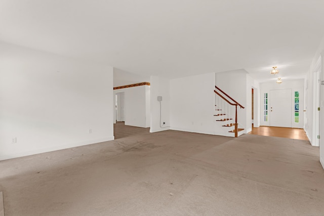 15 Sweet Meadow Dr, South Windsor, CT 06074 - unfurnished living room featuring carpet floors and stairs