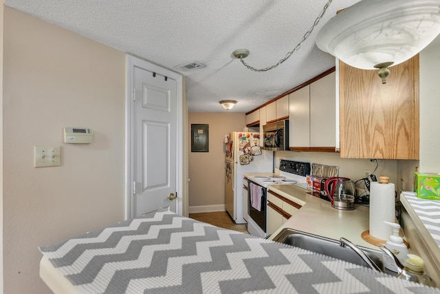157 Carriage Crossing Ln Unit 157, Middletown, CT 06457 - kitchen featuring white appliances, light countertops, a textured ceiling, and electric panel