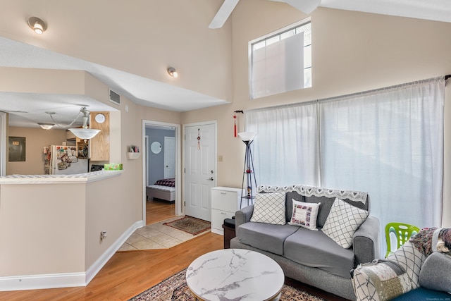 157 Carriage Crossing Ln Unit 157, Middletown, CT 06457 - living room featuring light wood-type flooring, a high ceiling, and electric panel