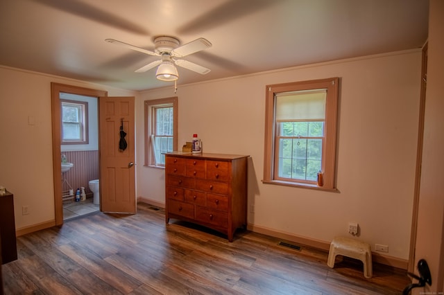 136 Cutler Rd, Killingly, CT 06241 - bedroom with multiple windows, wood finished floors, ensuite bath, and crown molding