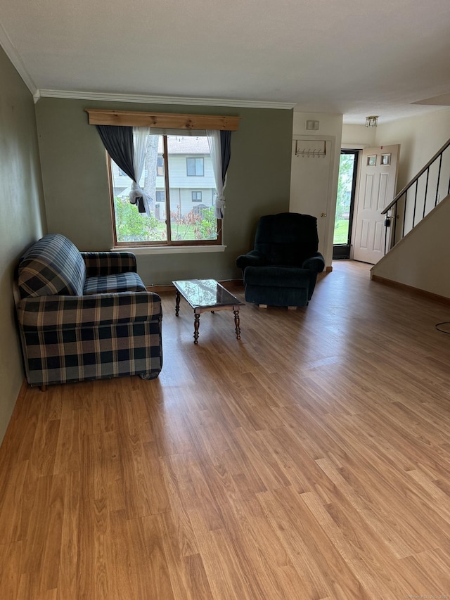 155 Cottonwood Rd Unit 155, Newington, CT 06051 - living room featuring light wood finished floors, crown molding, and stairway