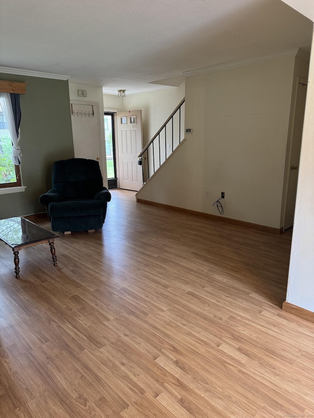 155 Cottonwood Rd Unit 155, Newington, CT 06051 - living room featuring light wood-style flooring, plenty of natural light, stairway, and crown molding