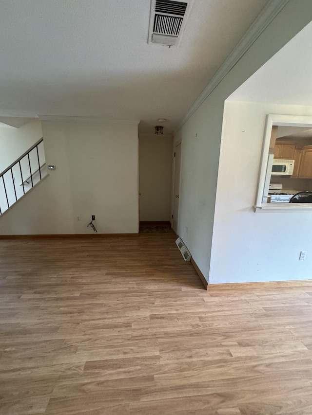 155 Cottonwood Rd Unit 155, Newington, CT 06051 - empty room with light wood-style floors, crown molding, and stairway
