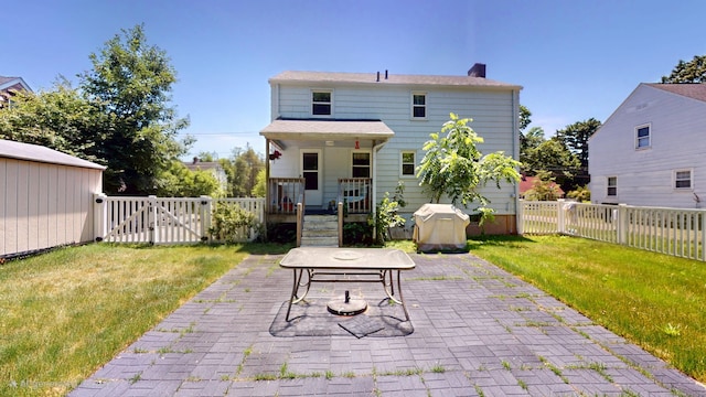 366 Hills St, East Hartford, CT 06118 - fenced backyard with a patio area and a gate