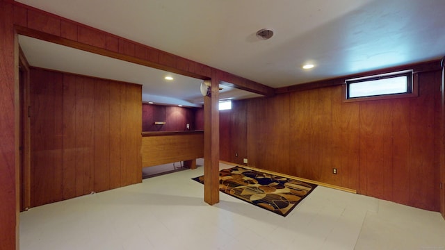 366 Hills St, East Hartford, CT 06118 - below grade area with tile patterned floors, wooden walls, and recessed lighting