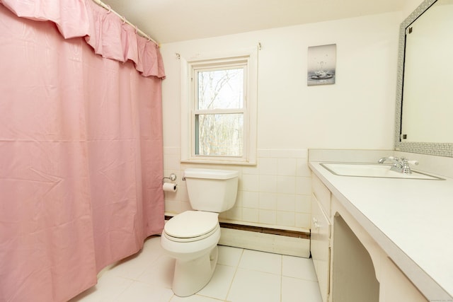 366 Hills St, East Hartford, CT 06118 - full bath with vanity, tile walls, tile patterned floors, and wainscoting