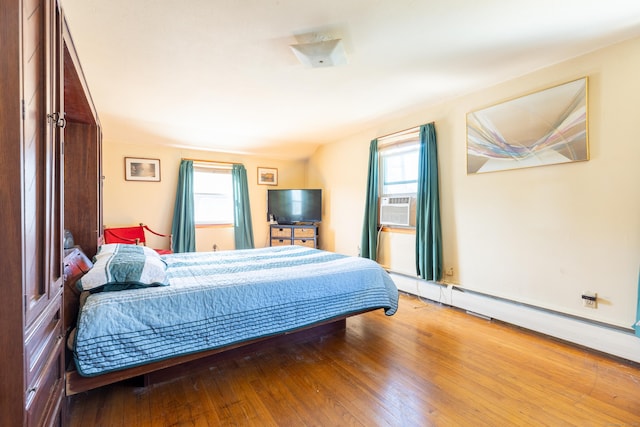 366 Hills St, East Hartford, CT 06118 - bedroom featuring multiple windows, hardwood / wood-style flooring, and cooling unit