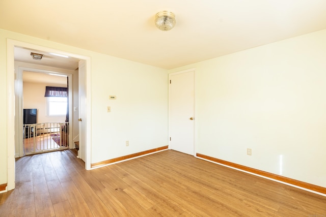 366 Hills St, East Hartford, CT 06118 - spare room with baseboards and light wood-style flooring