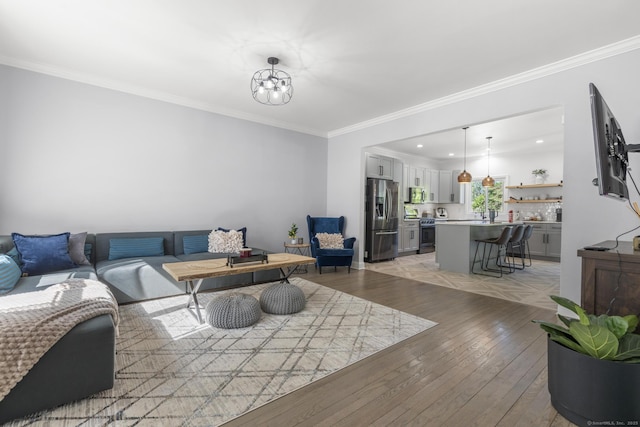11 Regan Cir, Shelton, CT 06484 - living area featuring light wood-style flooring, crown molding, a chandelier, and recessed lighting