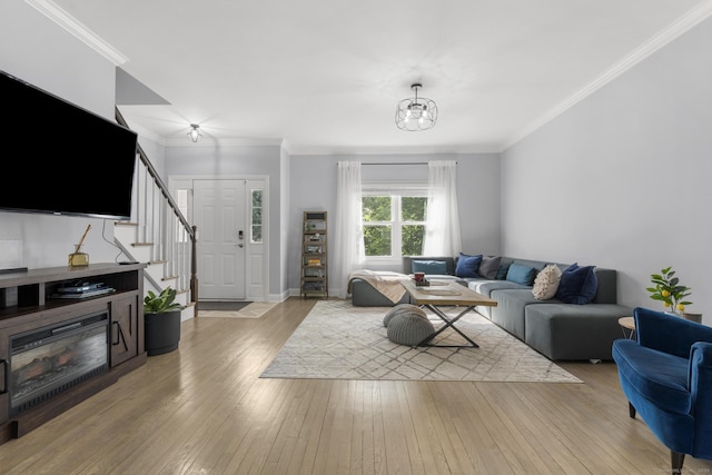 11 Regan Cir, Shelton, CT 06484 - living area with stairs, light wood-style flooring, crown molding, and a chandelier