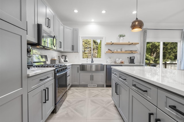 11 Regan Cir, Shelton, CT 06484 - kitchen with stainless steel appliances, gray cabinetry, healthy amount of natural light, crown molding, and recessed lighting