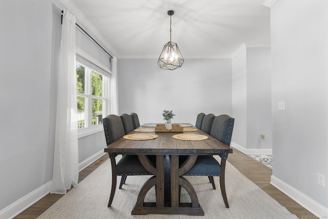 11 Regan Cir, Shelton, CT 06484 - dining room with wood finished floors, crown molding, and a chandelier