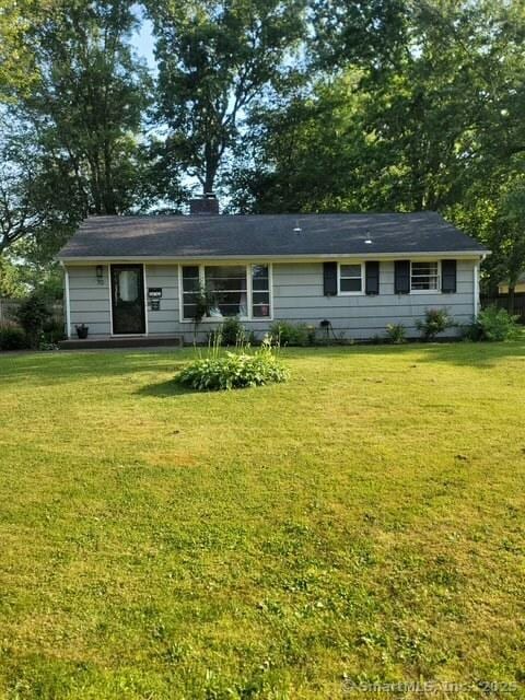 70 Ellsworth Dr, Bloomfield, CT 06002 - view of front facade featuring a front lawn and a chimney