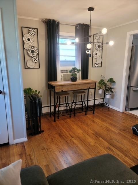 70 Ellsworth Dr, Bloomfield, CT 06002 - dining space with ornamental molding, wood finished floors, and baseboard heating
