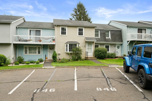 846 Long Hill Rd Unit 846, Middletown, CT 06457 - view of property featuring uncovered parking, entry steps, and a shingled roof