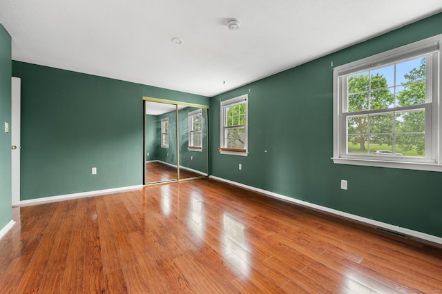 846 Long Hill Rd Unit 846, Middletown, CT 06457 - unfurnished bedroom featuring wood finished floors and a closet