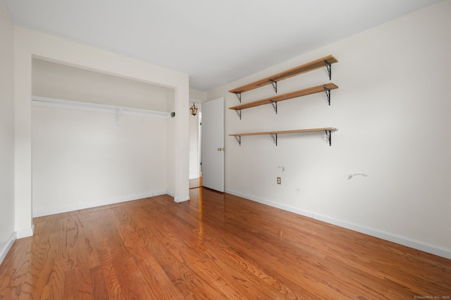 846 Long Hill Rd Unit 846, Middletown, CT 06457 - unfurnished bedroom featuring wood finished floors and baseboards