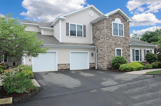 36 Todd St Unit 606, Hamden, CT 06518 - view of front of home with stone siding, asphalt driveway, and a shingled roof