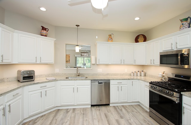 36 Todd St Unit 606, Hamden, CT 06518 - kitchen featuring stainless steel appliances, white cabinetry, ceiling fan, light wood-style flooring, and recessed lighting