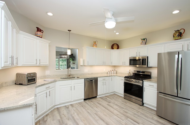 36 Todd St Unit 606, Hamden, CT 06518 - kitchen featuring stainless steel appliances, white cabinets, ceiling fan, light wood-style flooring, and recessed lighting