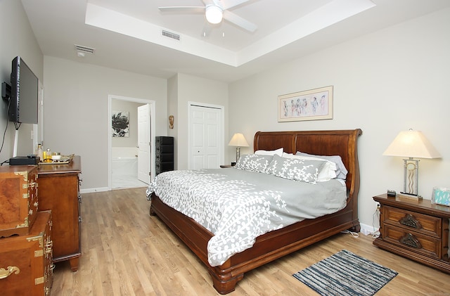 36 Todd St Unit 606, Hamden, CT 06518 - bedroom featuring light wood finished floors, a tray ceiling, a closet, and ensuite bathroom