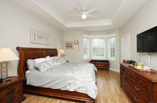 36 Todd St Unit 606, Hamden, CT 06518 - bedroom with a raised ceiling, light wood-style flooring, and ceiling fan