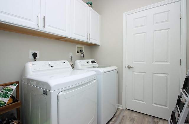36 Todd St Unit 606, Hamden, CT 06518 - laundry room with washer and clothes dryer, cabinet space, and light wood-style flooring