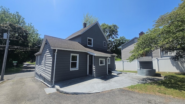 83 Mulberry St, Stamford, CT 06907 - view of front facade with a patio and a shingled roof