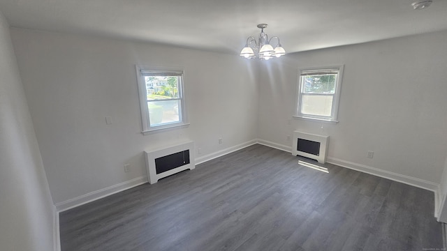 83 Mulberry St, Stamford, CT 06907 - unfurnished living room featuring a fireplace, a chandelier, and dark wood-style floors