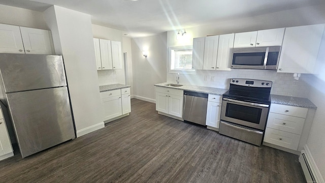 83 Mulberry St, Stamford, CT 06907 - kitchen with stainless steel appliances, baseboard heating, and dark wood-style flooring