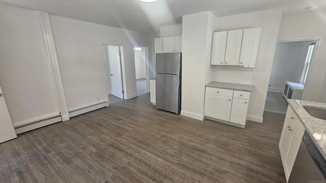 83 Mulberry St, Stamford, CT 06907 - kitchen featuring appliances with stainless steel finishes, dark wood finished floors, white cabinetry, decorative backsplash, and light stone counters
