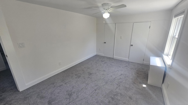 83 Mulberry St, Stamford, CT 06907 - unfurnished bedroom with carpet flooring, multiple windows, a closet, and a ceiling fan