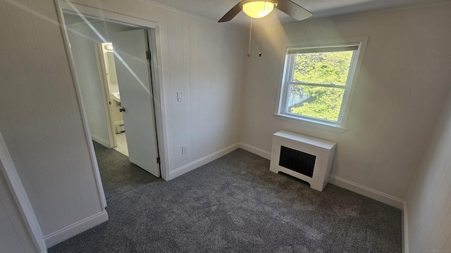 83 Mulberry St, Stamford, CT 06907 - unfurnished room with ceiling fan, dark carpet, and ornamental molding