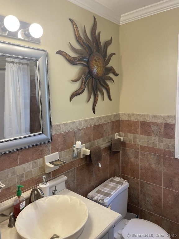 63 Lucy Cir, Wallingford, CT 06492 - bathroom featuring tile walls, vanity, ornamental molding, and a shower with curtain