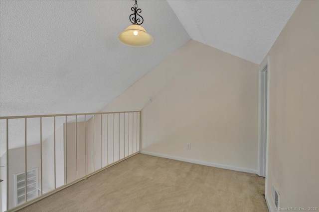 49 Carriage Crossing Ln Unit 49, Middletown, CT 06457 - bonus room featuring a textured ceiling, carpet, and vaulted ceiling