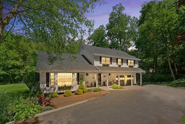 136 Knorr Rd, Monroe, CT 06468 - view of front of house with an attached garage, driveway, a shingled roof, and covered porch